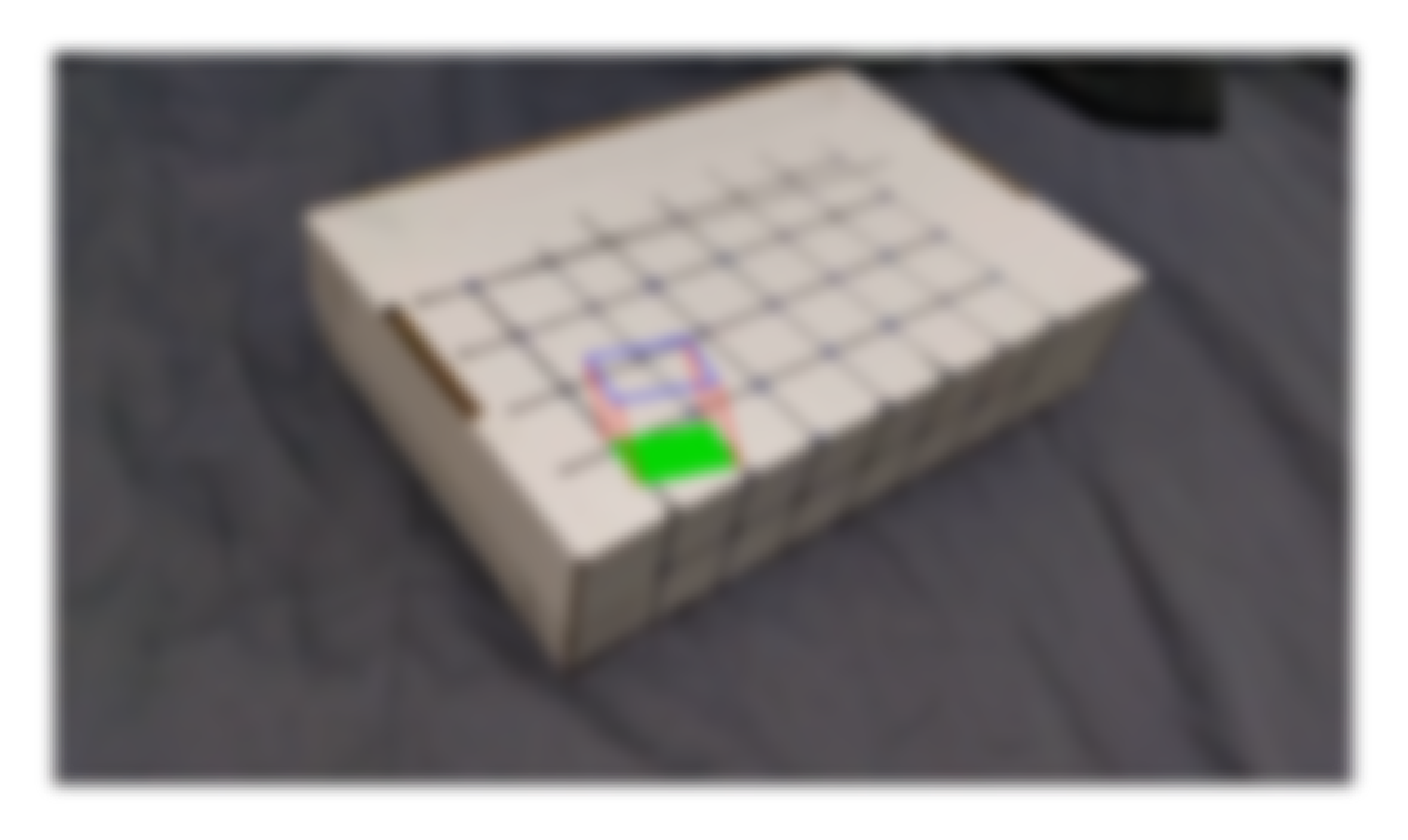Video of AR cube projected on box.