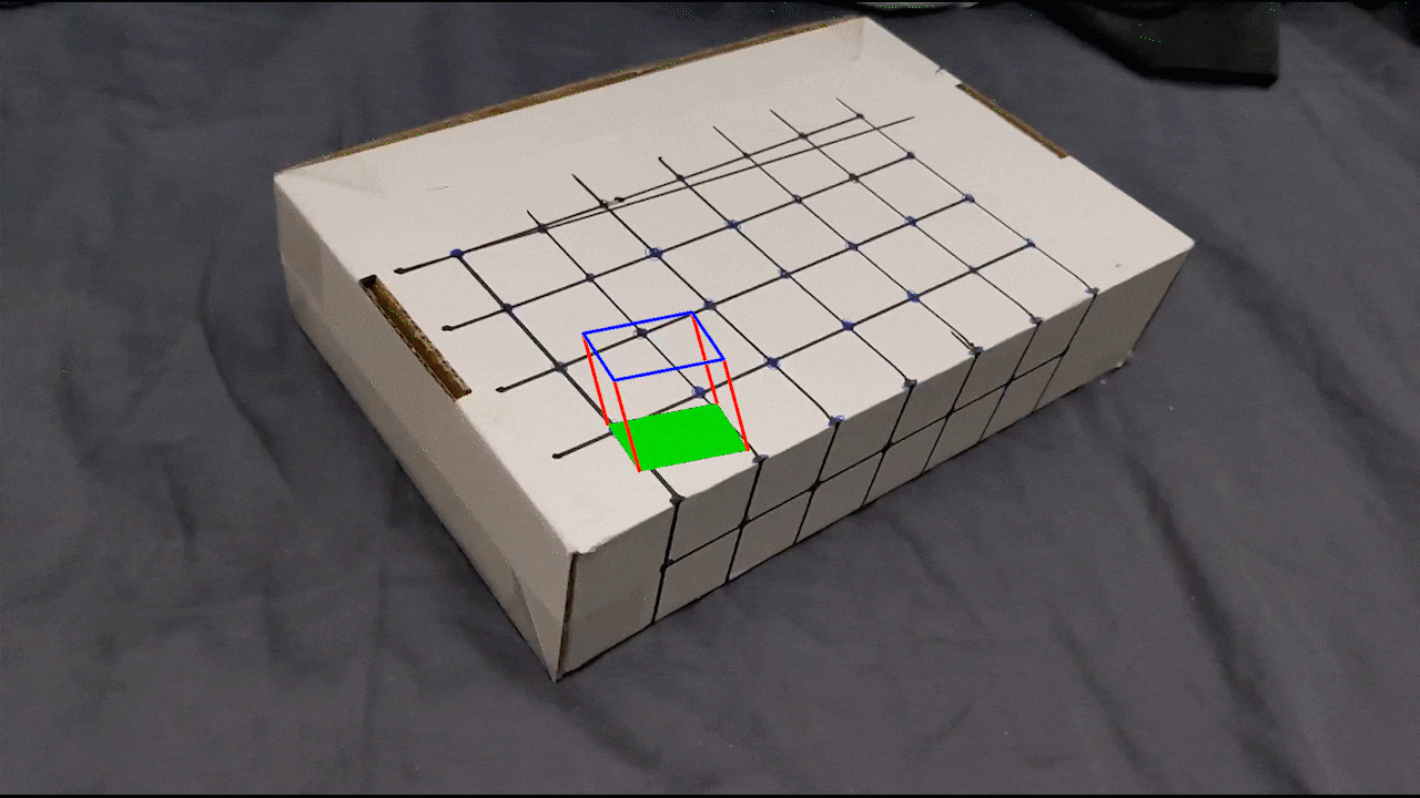 Video of AR cube projected on box.